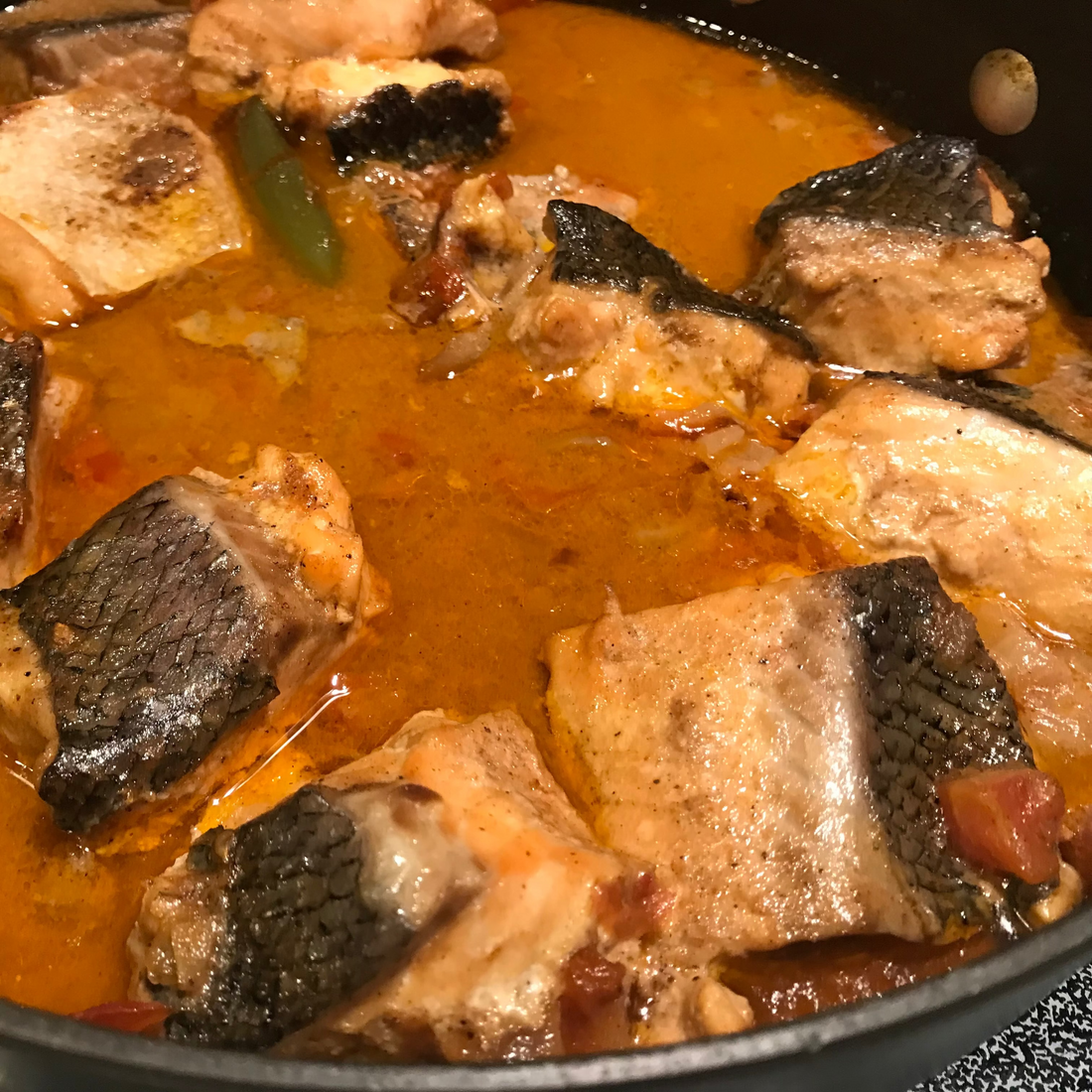 South Indian tangy fish curry with tamarind and curry leaves served over rice.