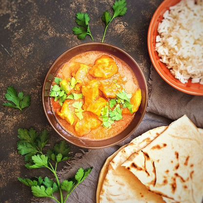Prepared Chicken tikka masala with rice and naan