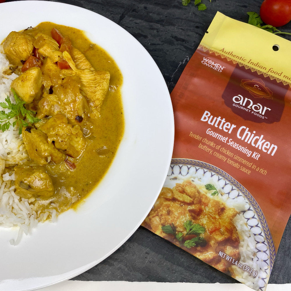 Bowl of Butter Chicken with white rice, made with Anar Gourmet Foods all natural, gluten-free seasoning