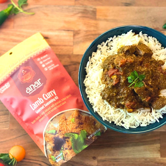 Anar Gourmet Foods all-natural, gluten-free lamb curry seasoning — lamb curry over rice with seasoning packet, garnished with cilantro