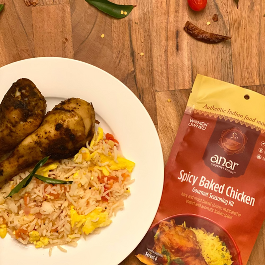 Anar Gourmet Foods all-natural, gluten-free spicy baked chicken, plated with tangy South Indian Pulihora rice next to the seasoning and recipe packet