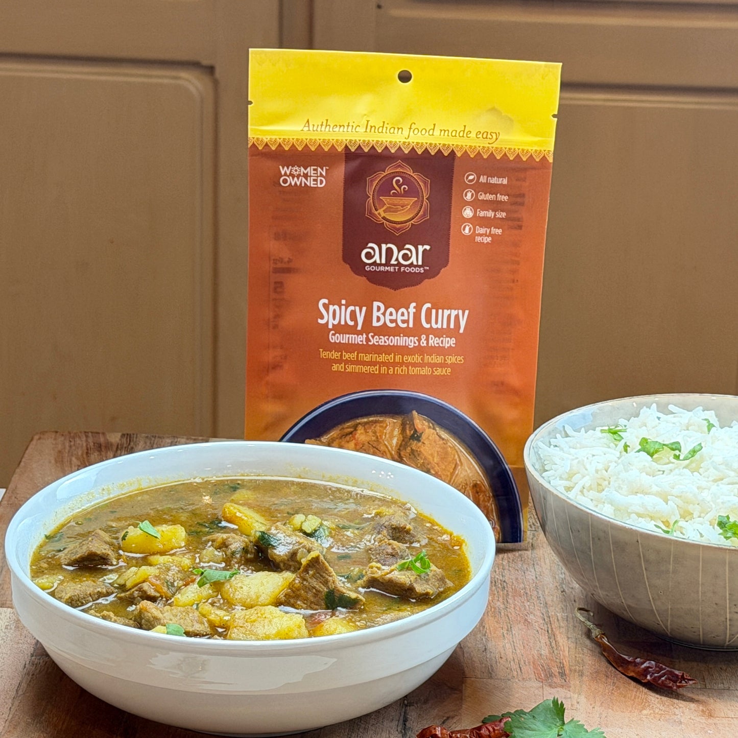 Anar Gourmet Foods all-natural, gluten-free spicy beef curry, served with basmati rice and seasoning package