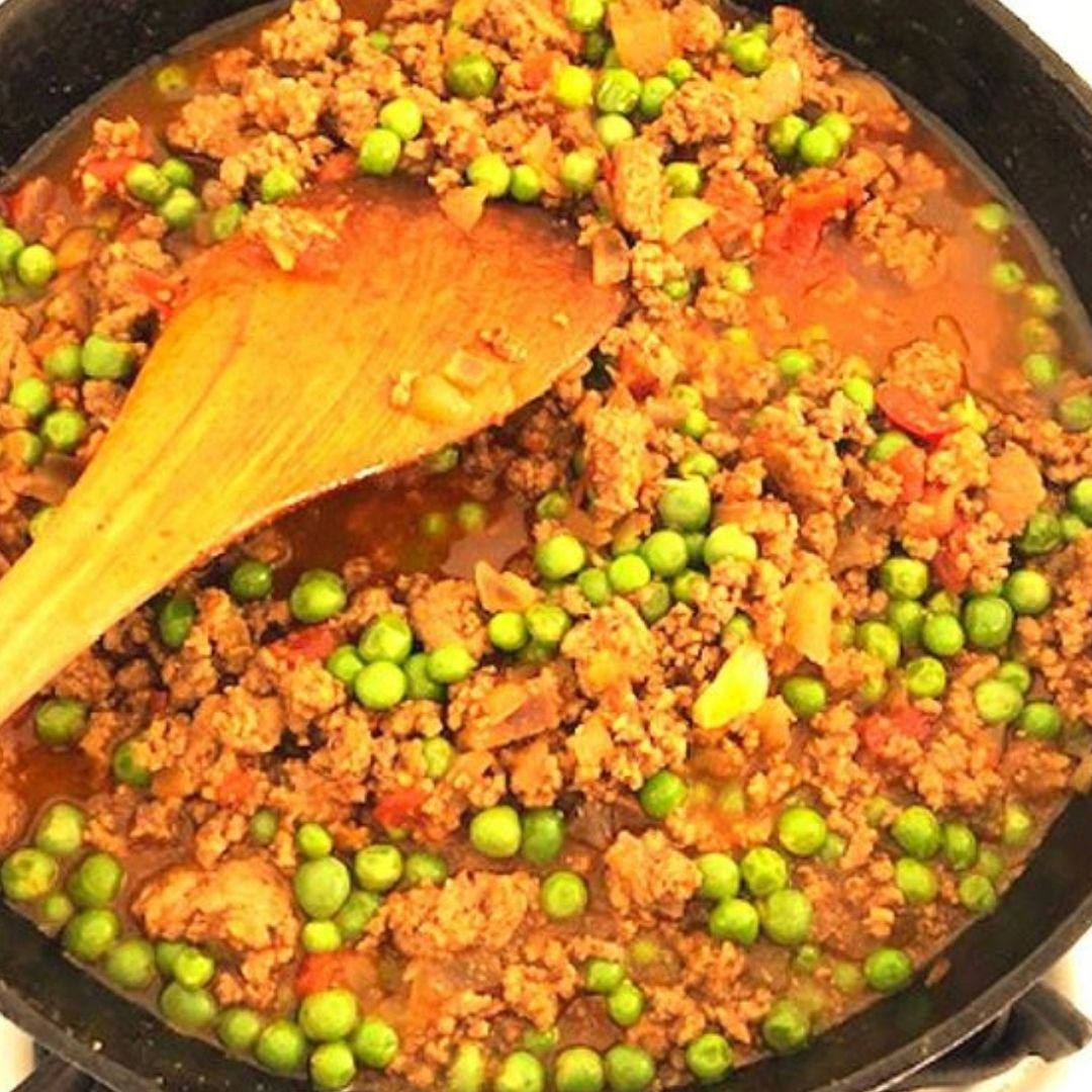 Ground Beef Keema Curry cooking in a skillet with peas, made by a customer using Anar Gourmet Foods all natural, gluten-free seasoning