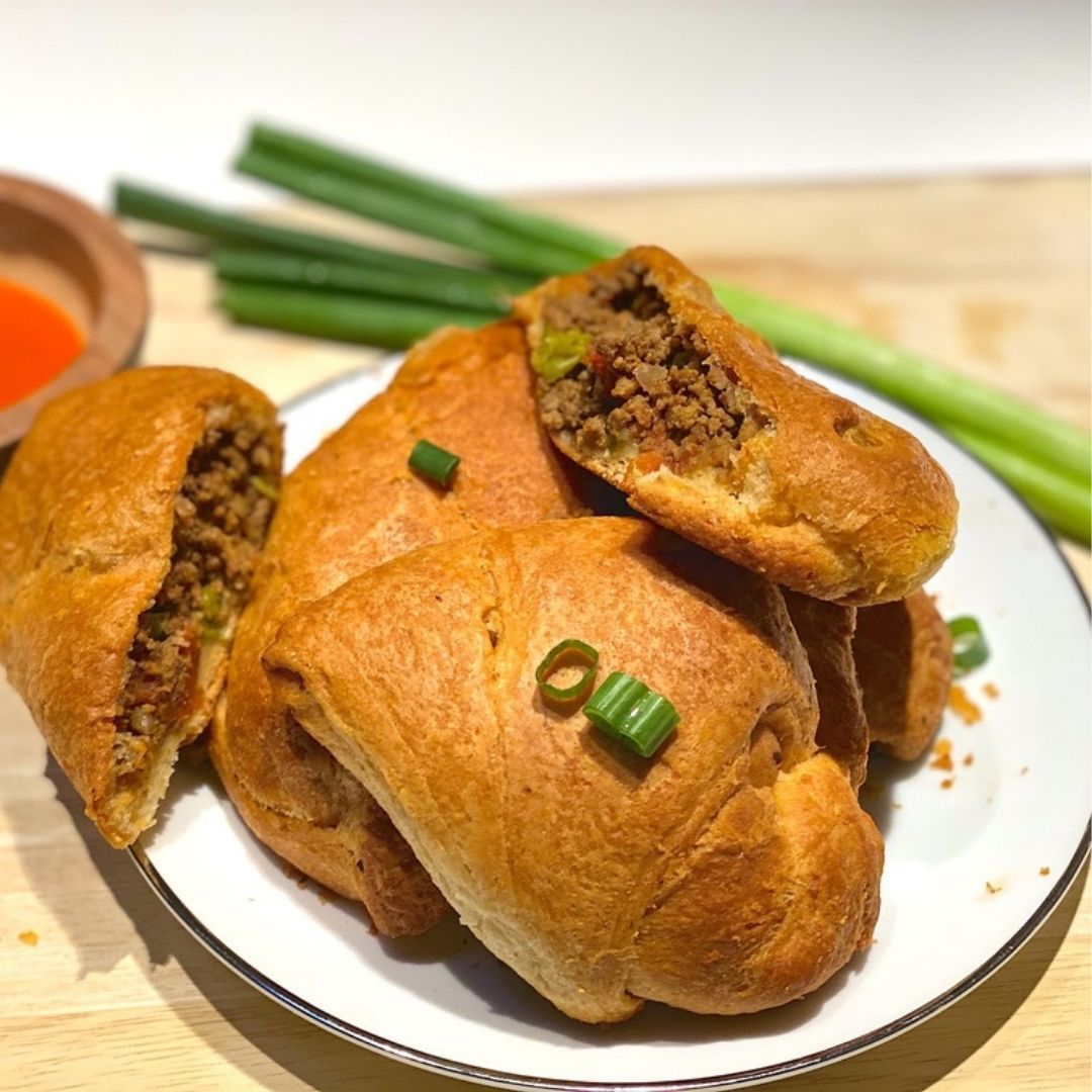 Ground Beef Keema Curry baked in a pastry crust turnover, garnished with scallions, made with Anar Gourmet Foods all natural, gluten-free seasoning
