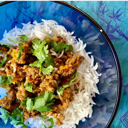 Ground Beef Keema Curry served over rice with fresh cilantro, made with Anar Gourmet Foods all natural, gluten-free seasoning