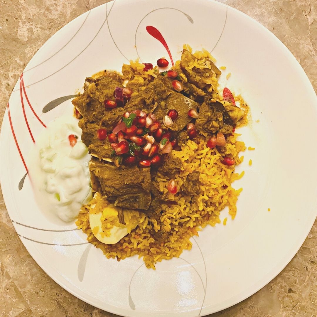 Anar Gourmet Foods all-natural, gluten-free lamb curry seasoning — serving suggestion with spiced rice, pomegranate, and raita