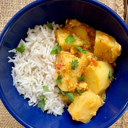 Anar Gourmet Foods all-natural, gluten-free potato curry, served over rice with cilantro