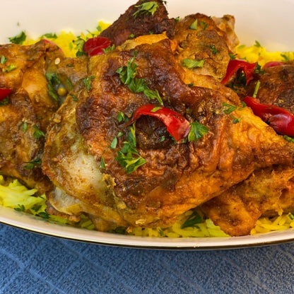Anar Gourmet Foods all-natural, gluten-free spicy baked chicken, plated over lemon rice with roasted peppers and cilantro