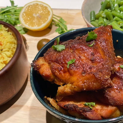 Anar Gourmet Foods all-natural, gluten-free spicy baked chicken, served with lemon rice, lemon wedge, and green beans